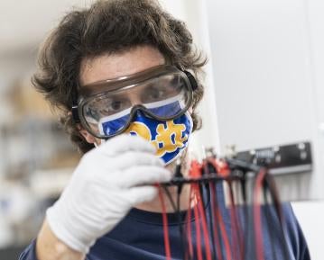 Student in lab wearing mask