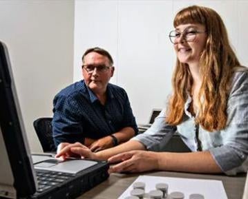 Student and professor on computer